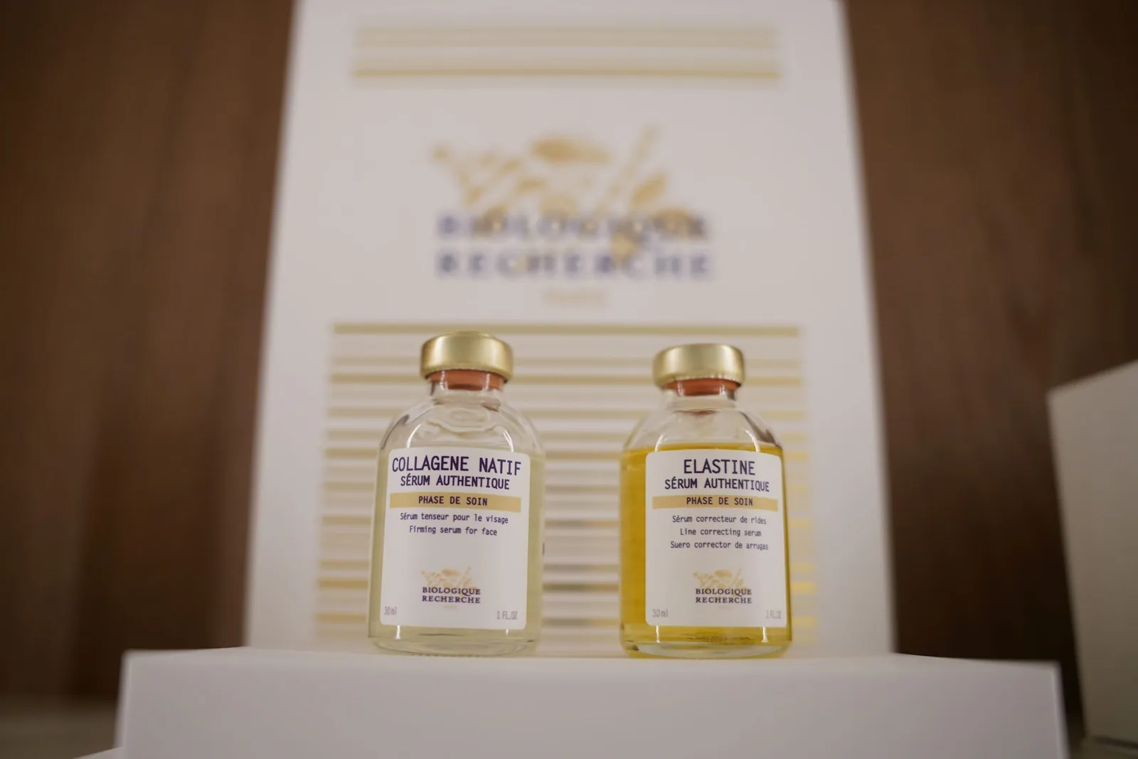 Two Biologique Recherche serums, Collagene Natif and Elastine, displayed on a shelf at the Miren Medic clinic.