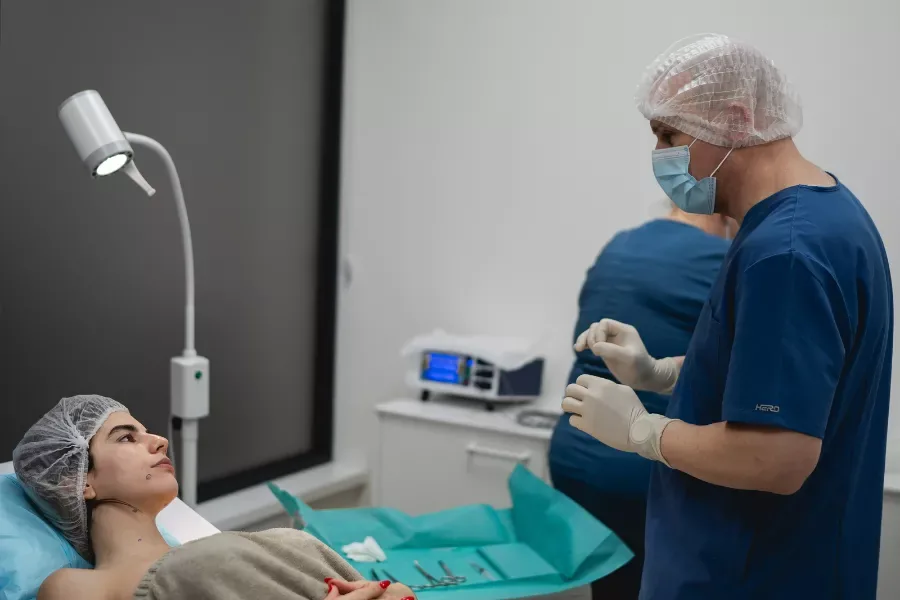 A surgeon at Miren Medic Polyclinic talking with a patient