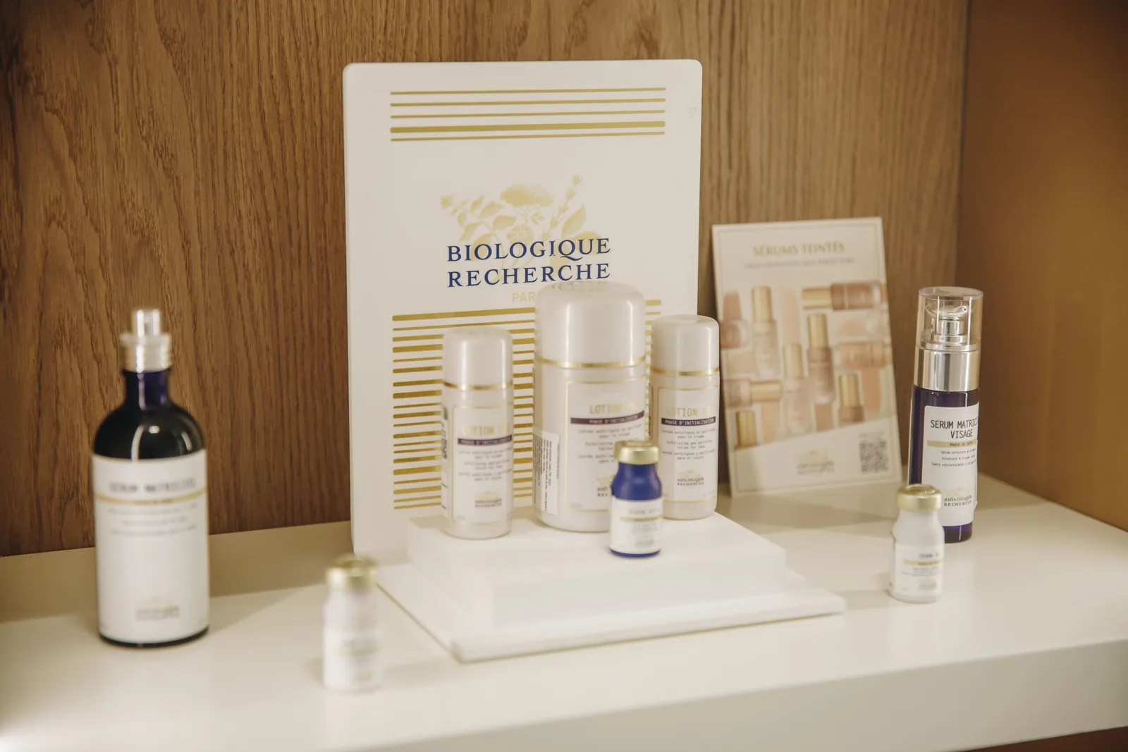 Display shelf at the Miren Medic clinic with Biologique Recherche Lotion P50 and serums in front of the branded sign.