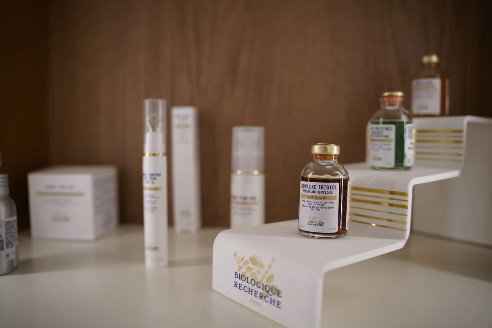 Close up of the Biologique Recherche Complexe Iribiol serum on a white stand at the Miren Medic clinic.