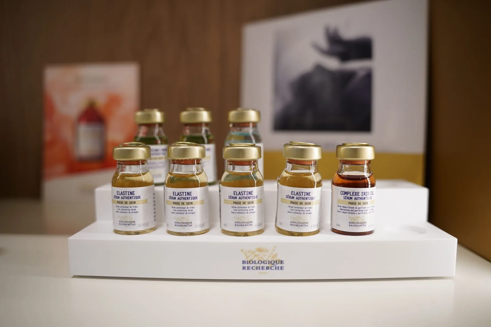 Close up of the Biologique Recherche Elastine and Complexe Iribiol serums on a stand at the Miren Medic clinic.