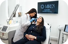 A doctor performing an aesthetic or dermatological examination of a patient's face, Miren Polyclinic, a private polyclinic in Belgrade