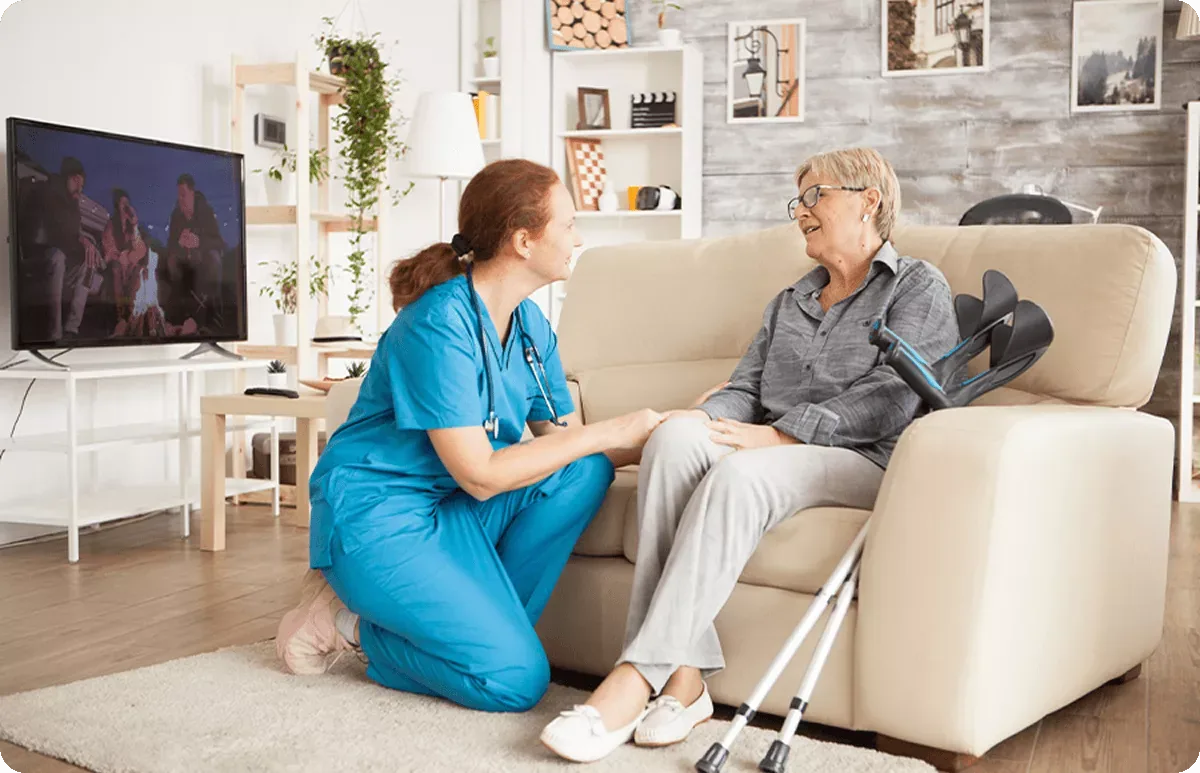 Medical staff from Mirenmedic Polyclinic providing home medical care to an older patient in her own home.