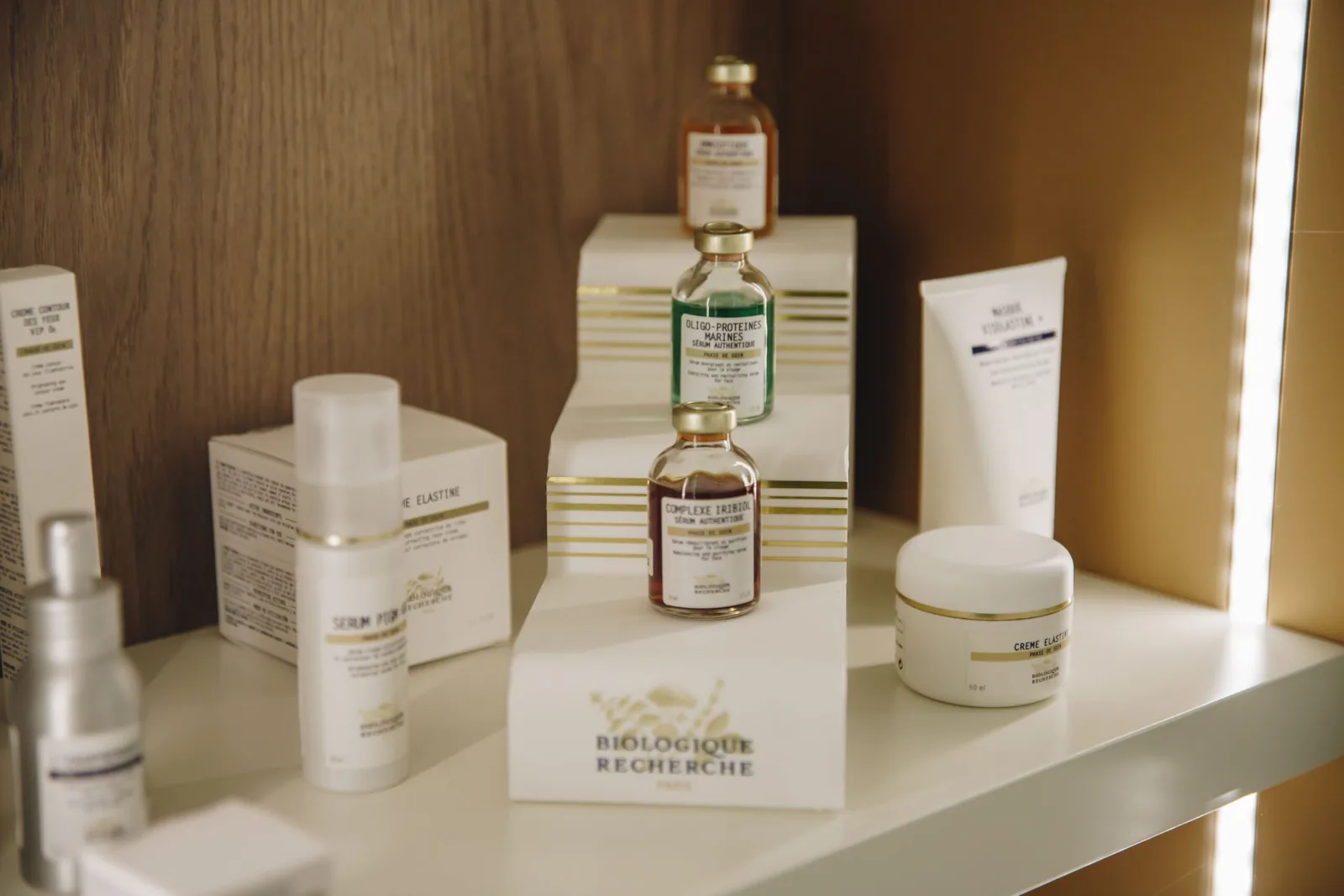 LED lit shelf of luxury Biologique Recherche skincare products at the Miren Medic clinic.