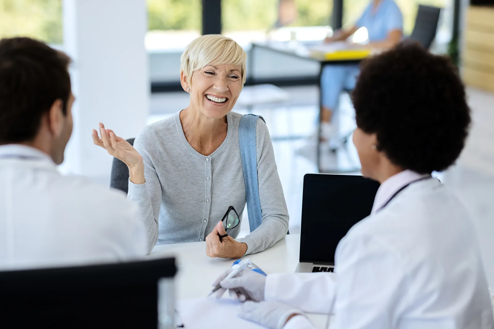 Mature woman talking with a doctor during a consultation at the clinic